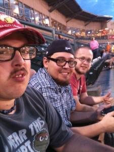 (from l to right) Patrick, Jake, and Jman @ the baseball game...nice face, honey...